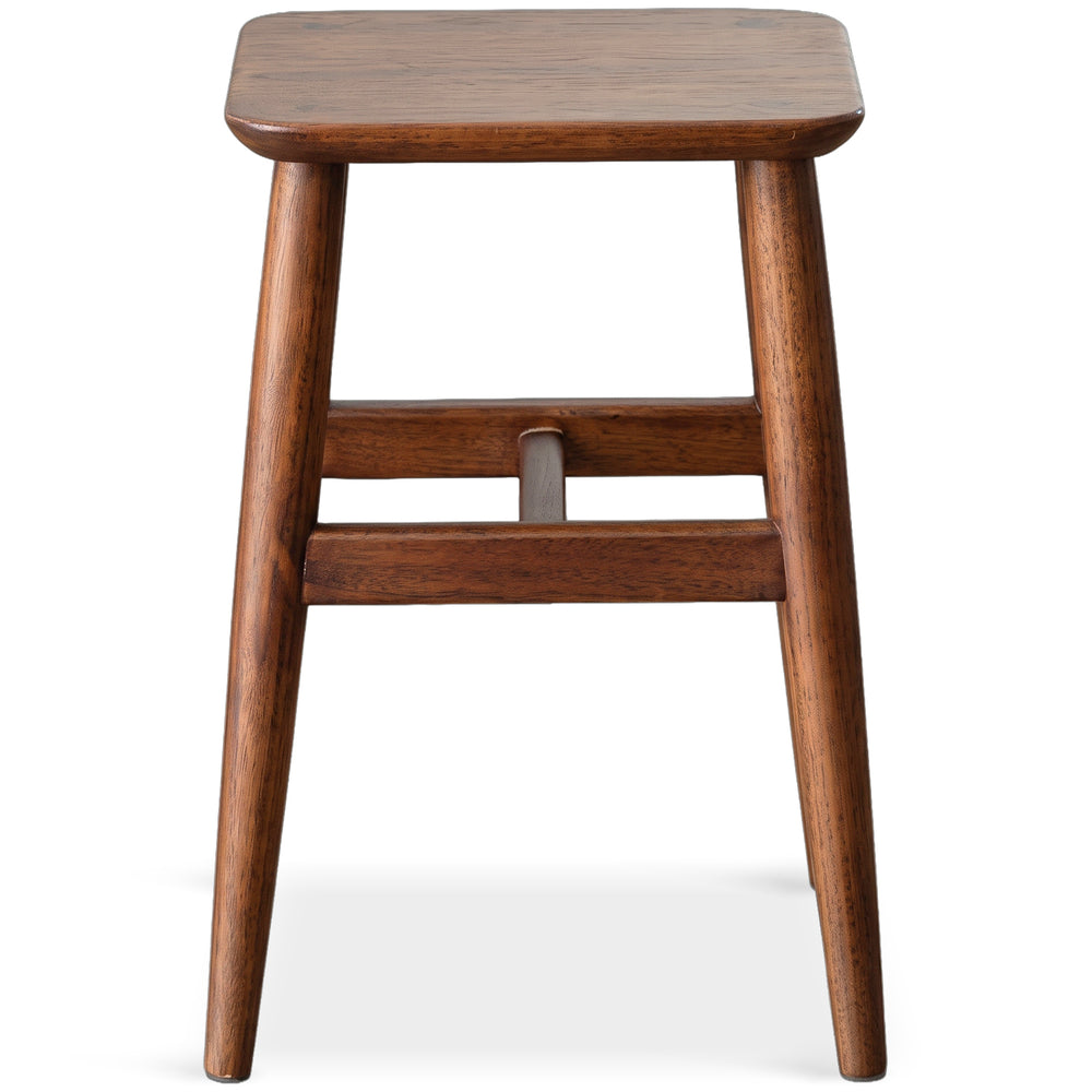 Vintage boxwood stool mellow in white background.