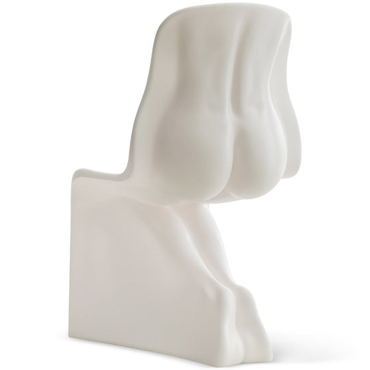 Bauhaus plastic dining chair her in white background.