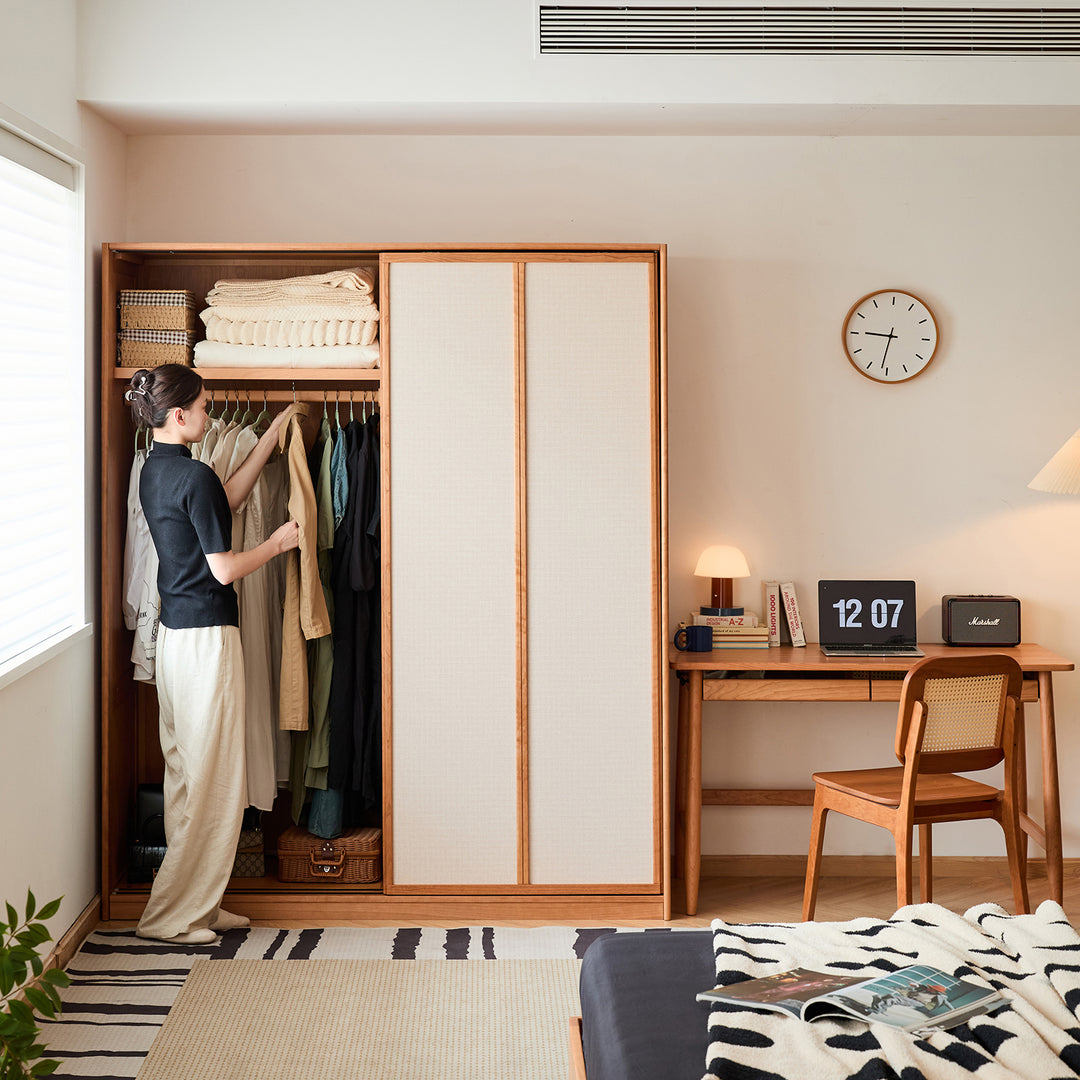 Scandinavian cherry wood sliding door wardrobe kangaroo in close up details.