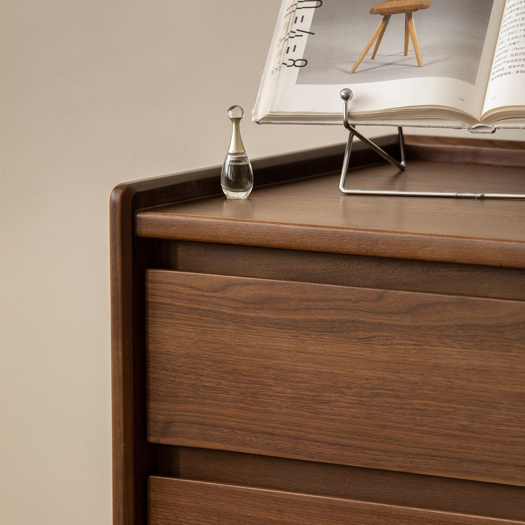 Vintage walnut wood chest of drawers vista with context.