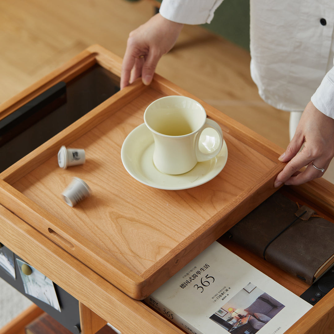 Scandinavian cherry wood wheeled trolley side table pocket in real life style.