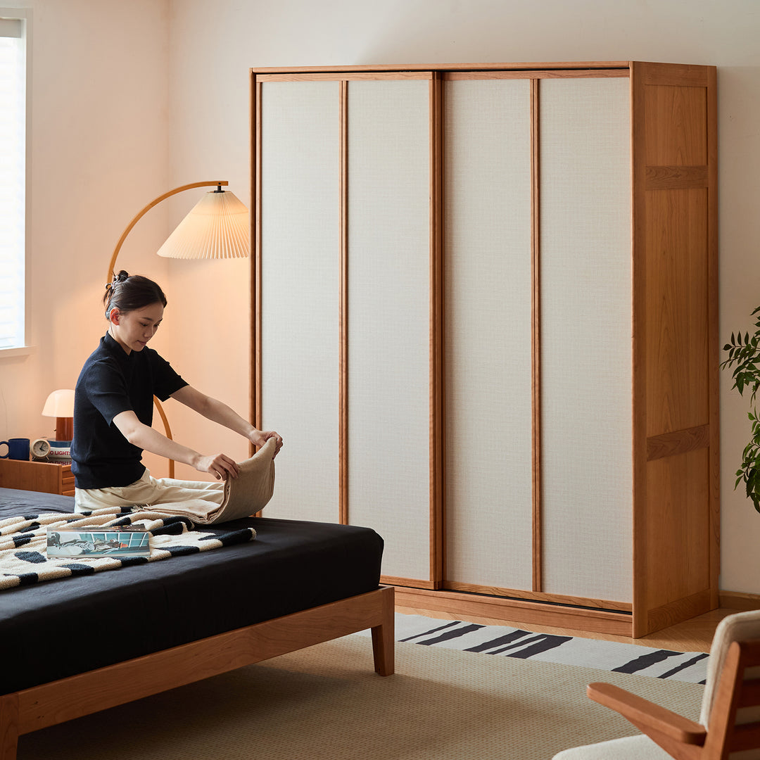 Scandinavian cherry wood sliding door wardrobe kangaroo in panoramic view.