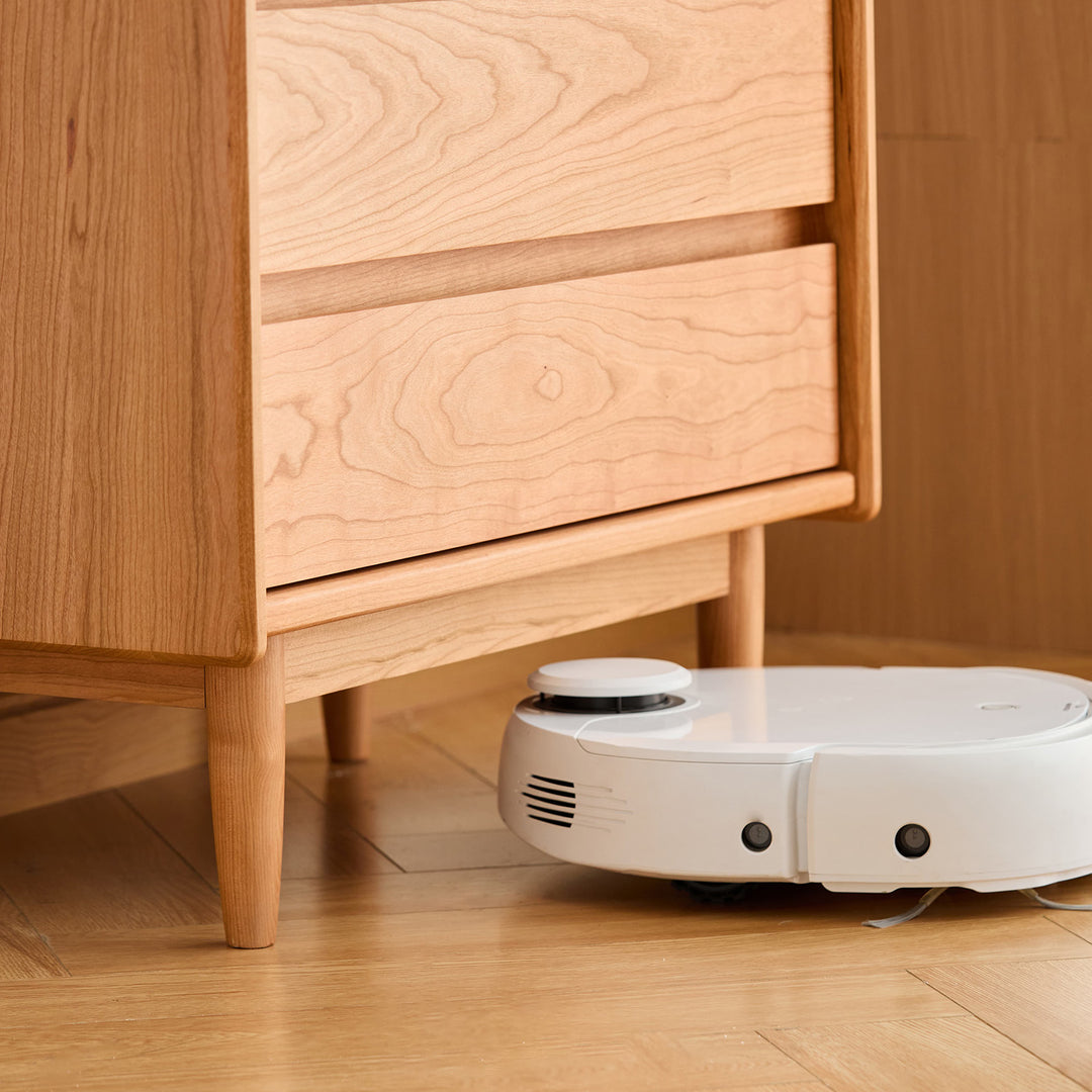 Scandinavian cherry wood chest of drawers vista in close up details.