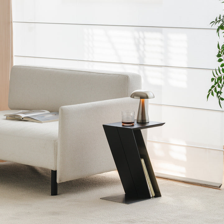 Minimalist stainless steel side table zig with context.