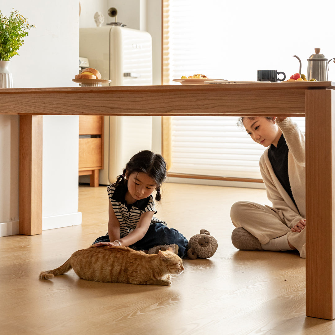 Scandinavian cherry wood dining table shoreline with context.