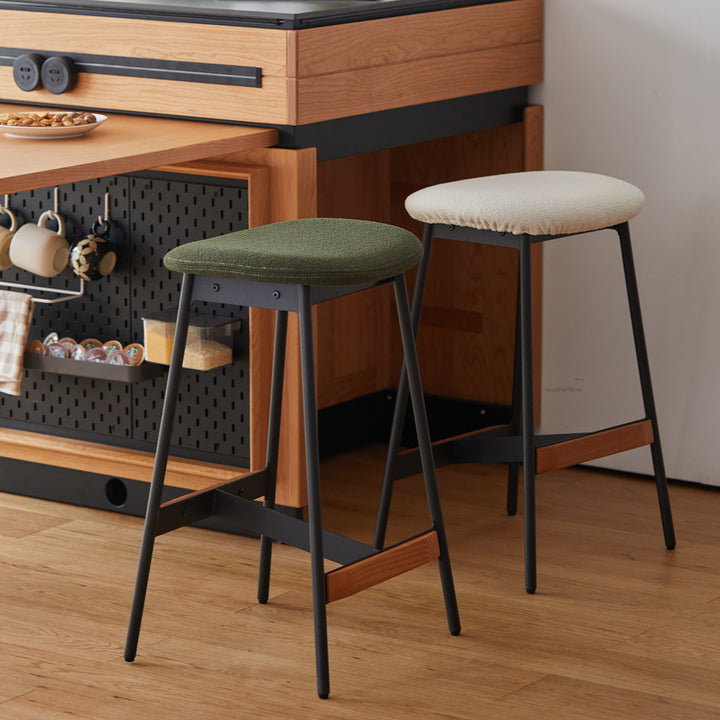 Modern boucle fabric bar chair bird with context.