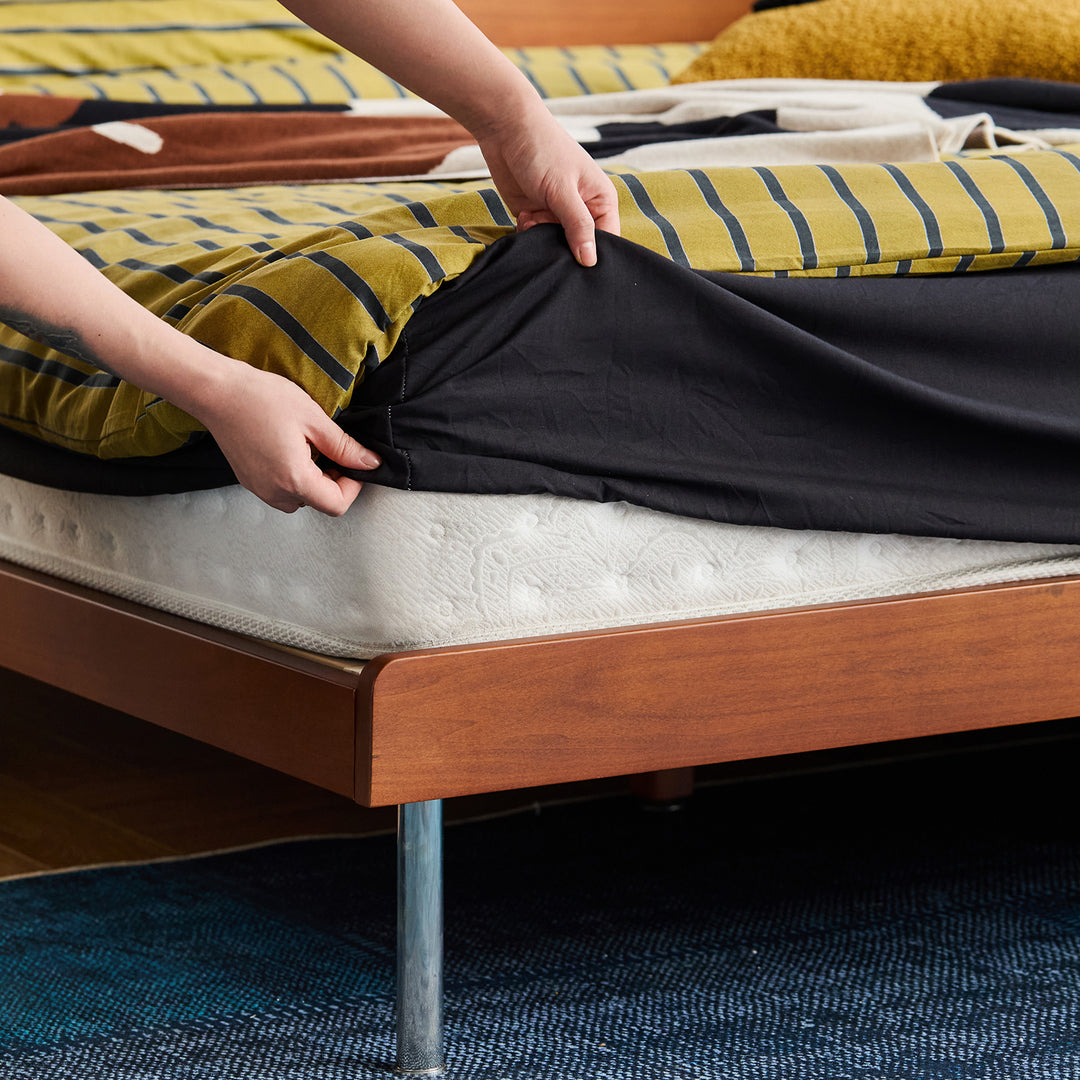 Vintage boxwood platform bed campan in close up details.
