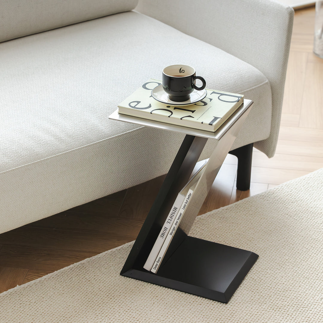 Minimalist stainless steel side table zig in details.