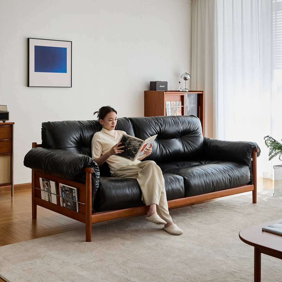 Scandinavian chenille velvet fabric boxwood 3 seater sofa open backed in still life.