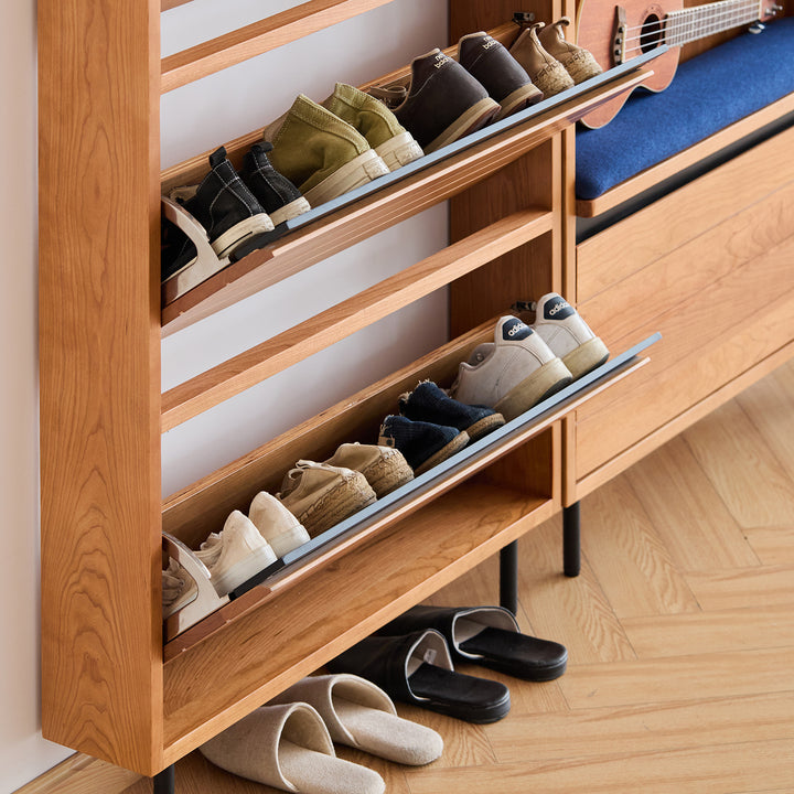 Scandinavian cherry wood shoe cabinet corner in details.