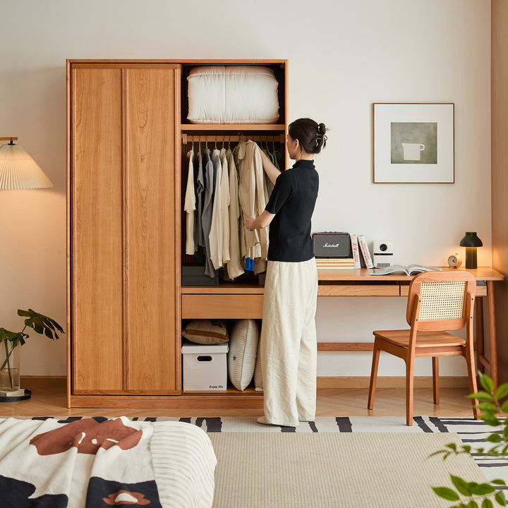 Scandinavian cherry wood sliding door wardrobe kangaroo in still life.