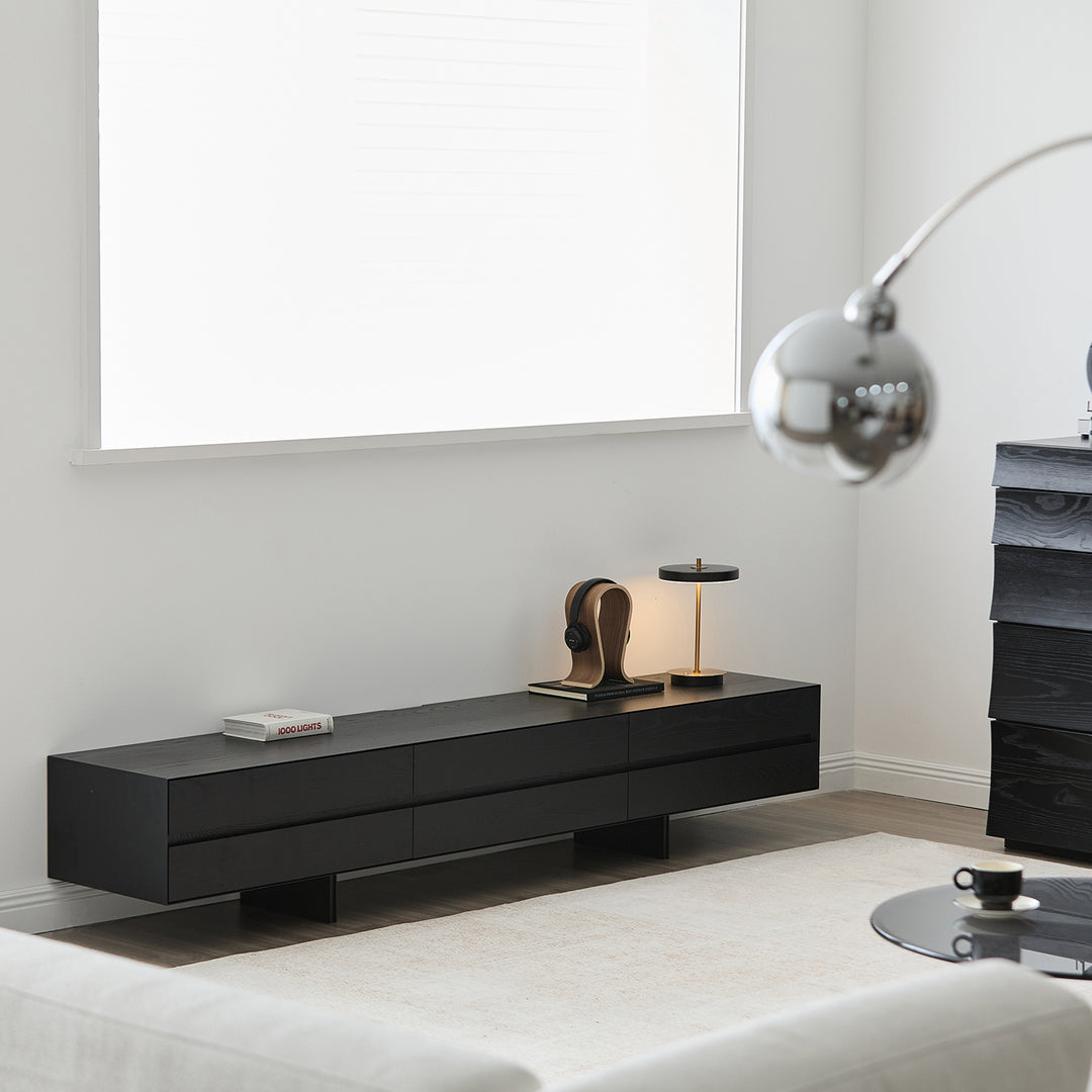 Minimalist ash wood tv console shadow in close up details.