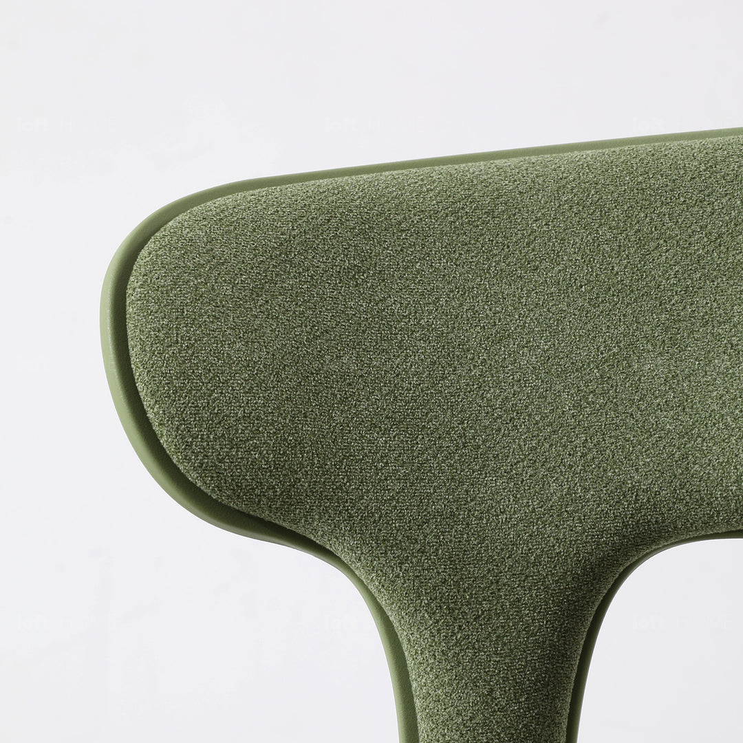Contemporary fabric plastic dining chair hug with context.