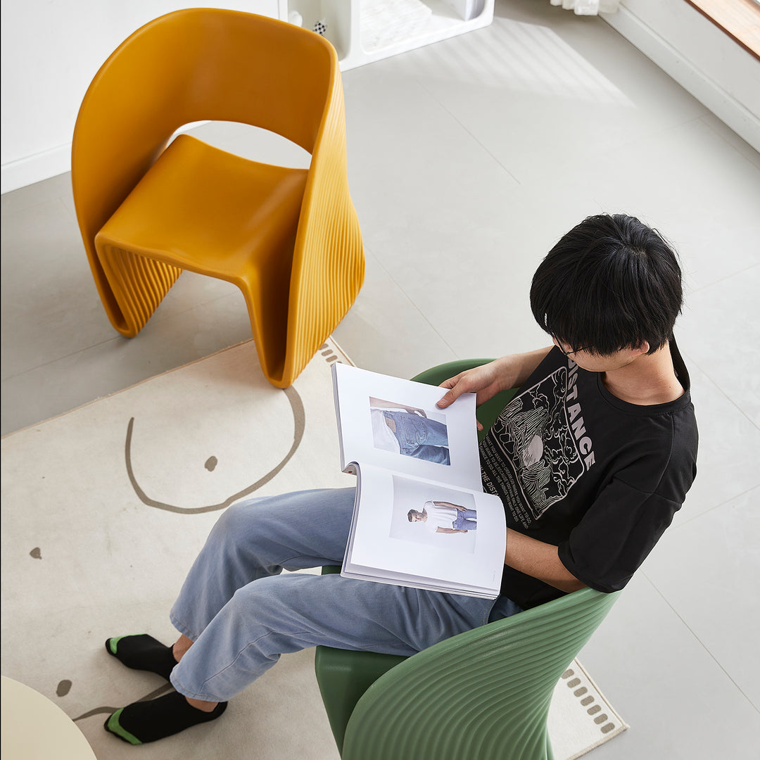Contemporary plastic dining chair flip with context.