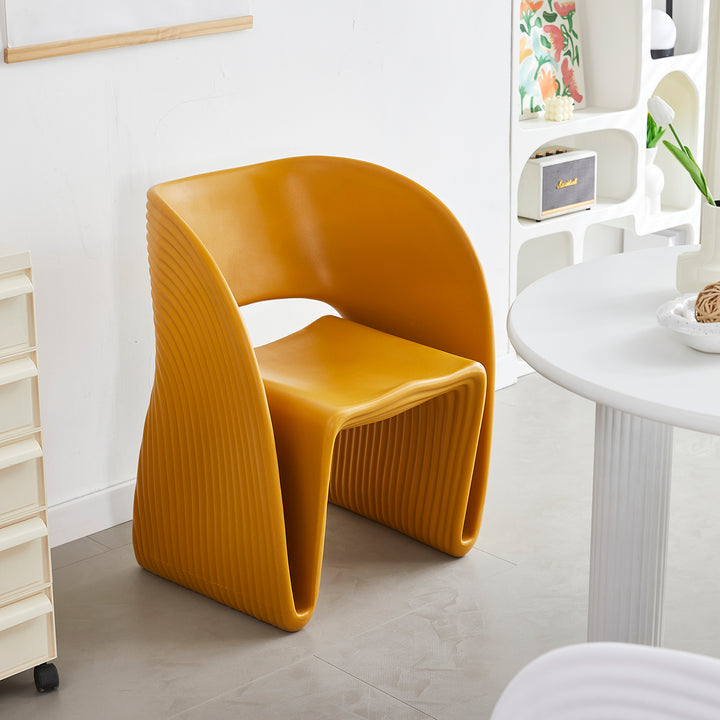 Contemporary plastic dining chair flip in still life.