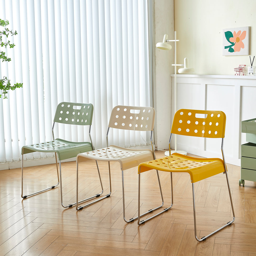 Contemporary plastic dining chair omkstak in real life style.