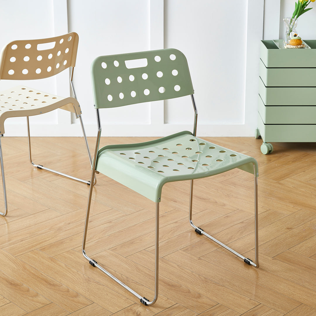 Contemporary plastic dining chair omkstak with context.