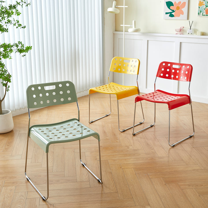 Contemporary plastic dining chair omkstak in close up details.