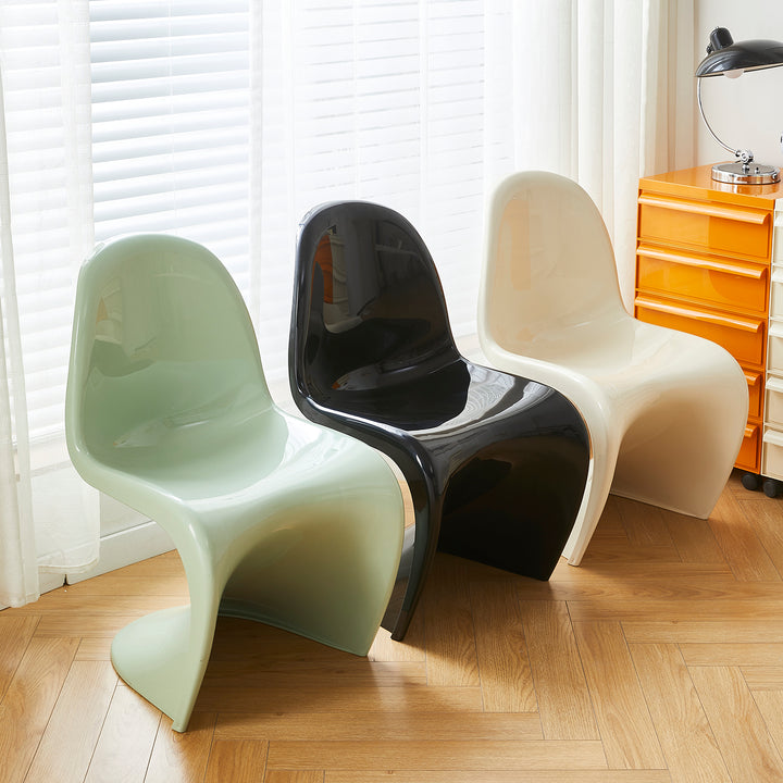 Contemporary plastic dining chair panton with context.