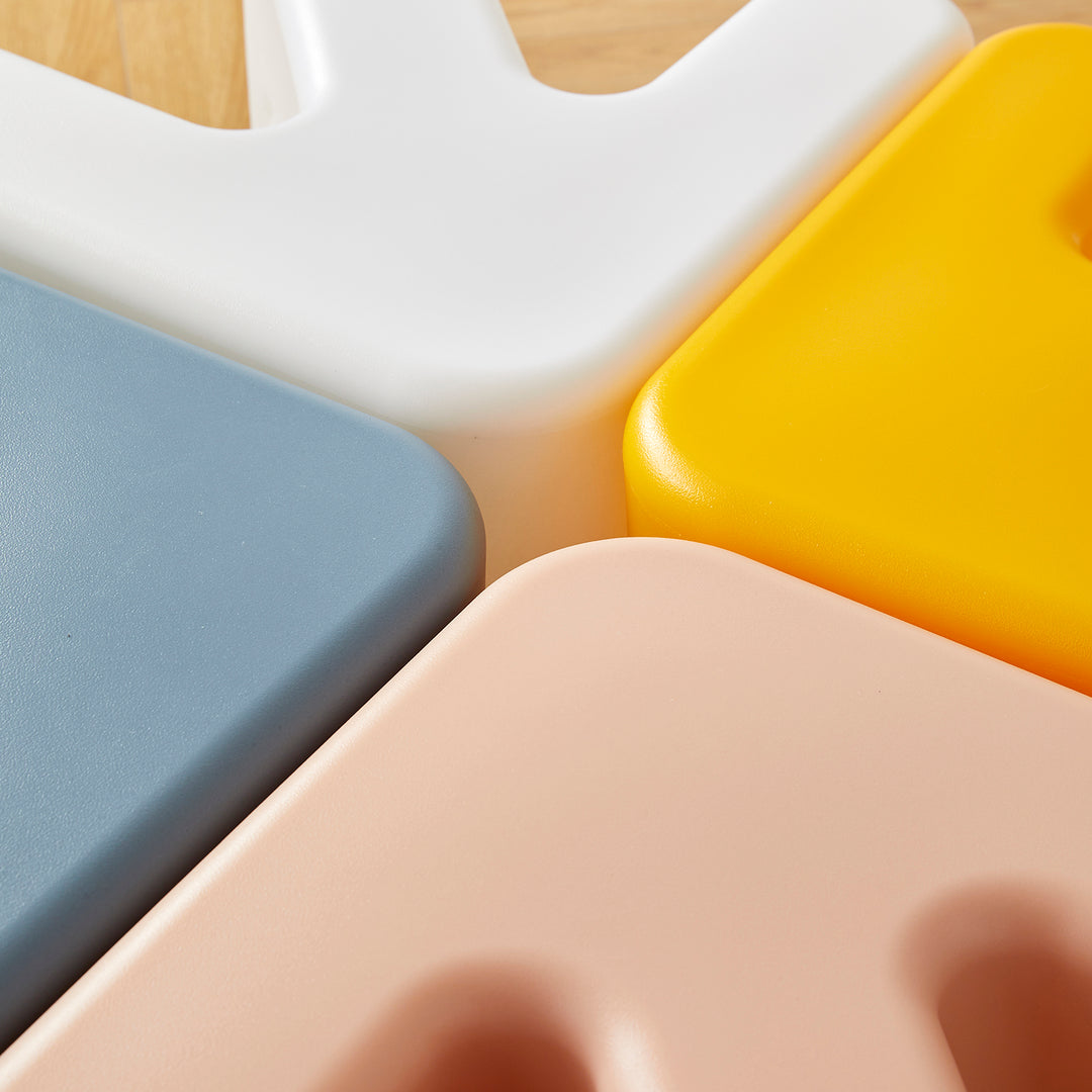 Contemporary plastic stool side table arrow in real life style.