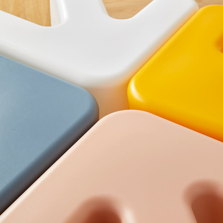 Contemporary plastic stool side table arrow in real life style.