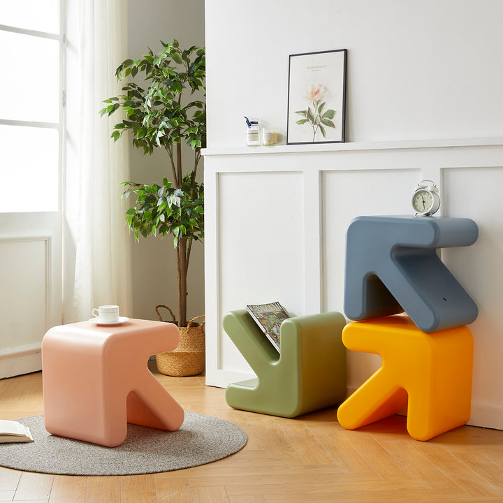 Contemporary plastic stool side table arrow in close up details.