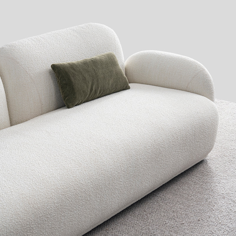 Cream boucle fabric 2 seater sofa pluum in real life style.