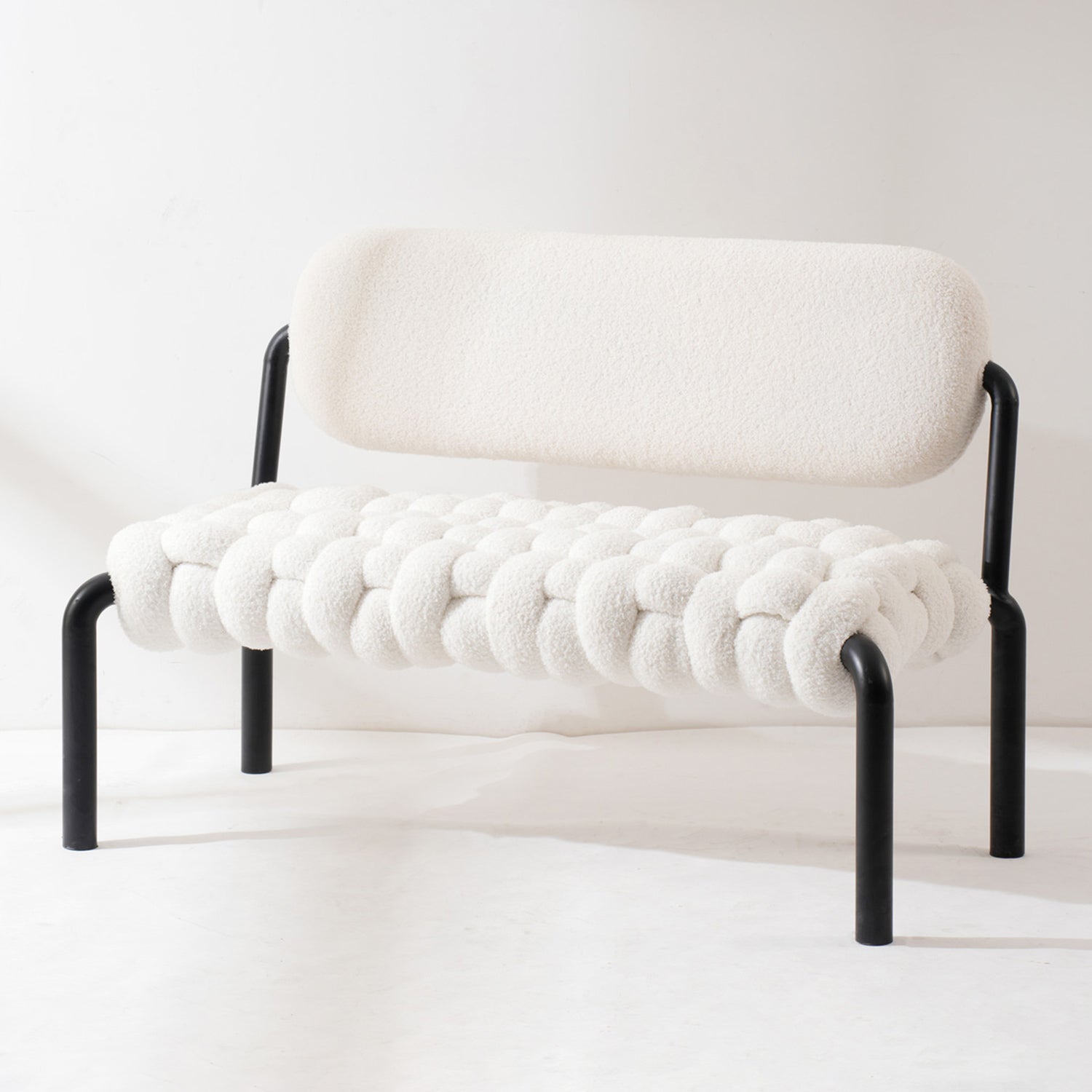 Cream boucle fabric dining bench souffle layered structure.