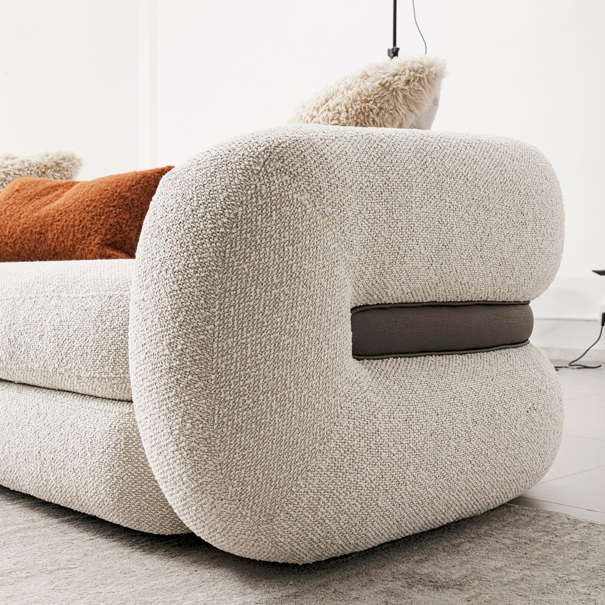 Cream boucle fabric 1 seater sofa curly with context.