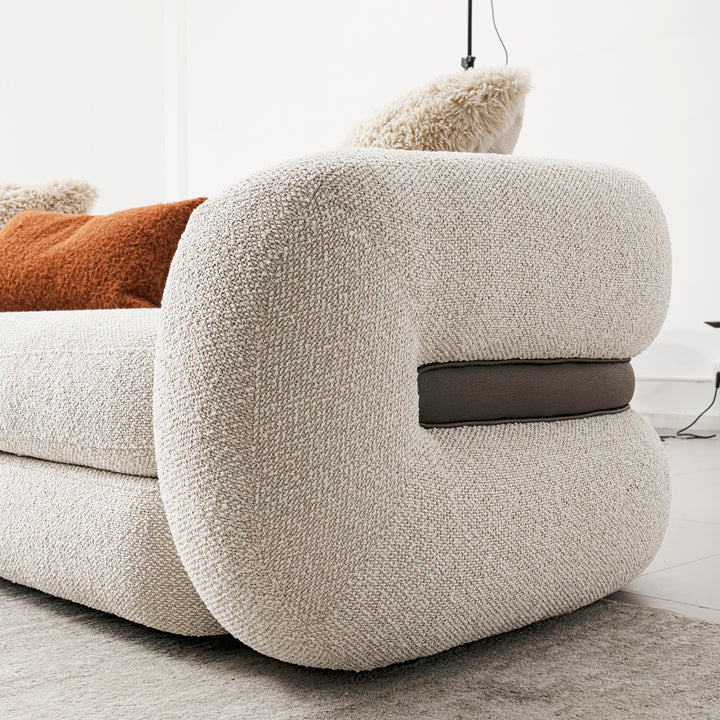 Cream boucle fabric 1 seater sofa curly with context.