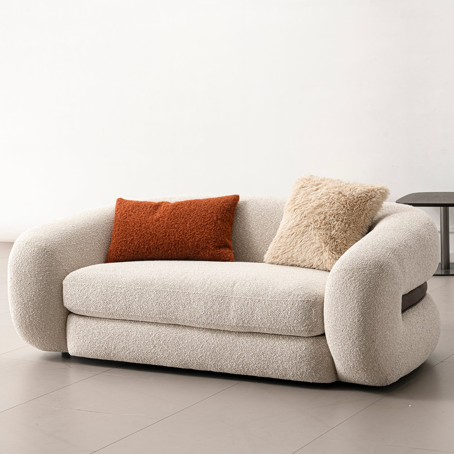 Cream boucle fabric 2 seater sofa curly in panoramic view.
