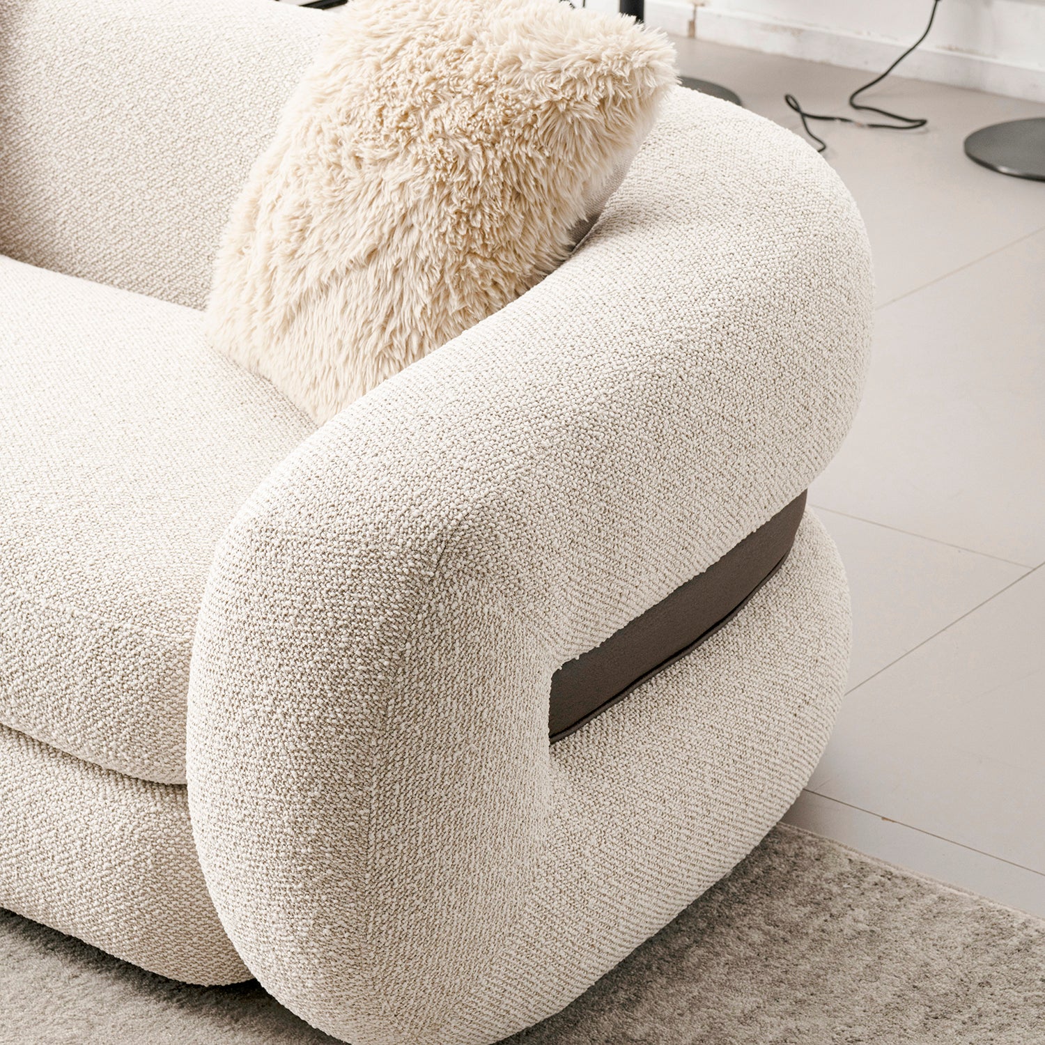 Cream boucle fabric 2 seater sofa curly with context.