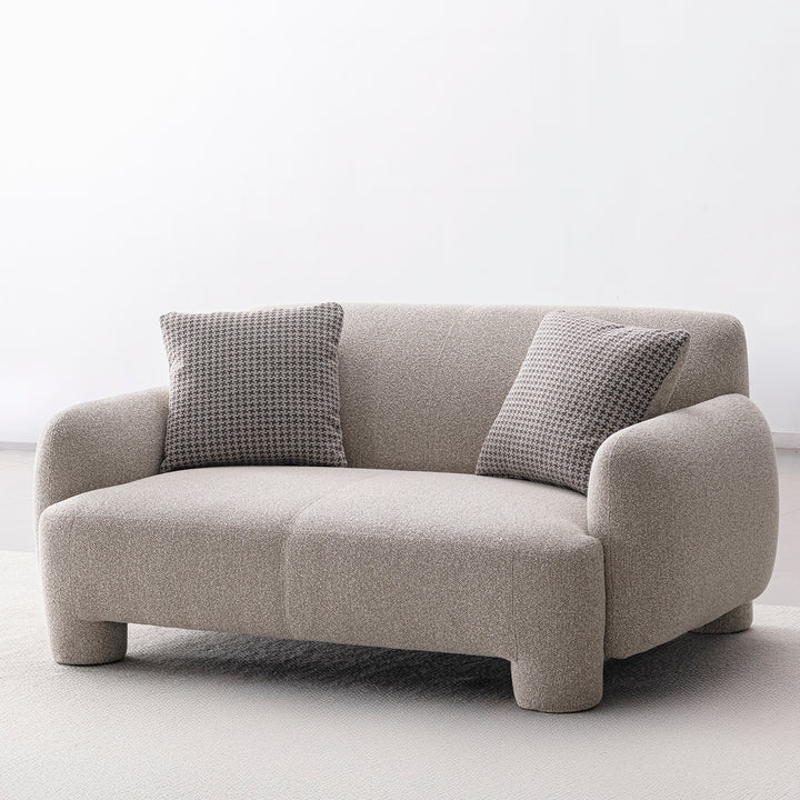 Cream mixed weave fabric 2 seater sofa syra in panoramic view.