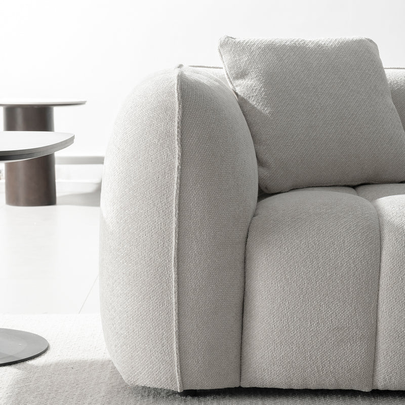 Cream mixed weave fabric 4 seater sofa puddy in real life style.
