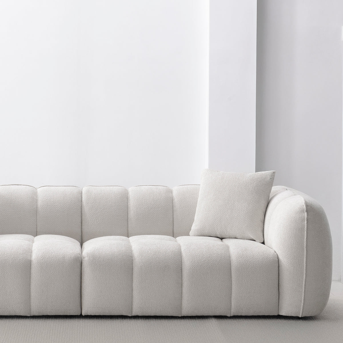 Cream mixed weave fabric 4 seater sofa puddy in panoramic view.