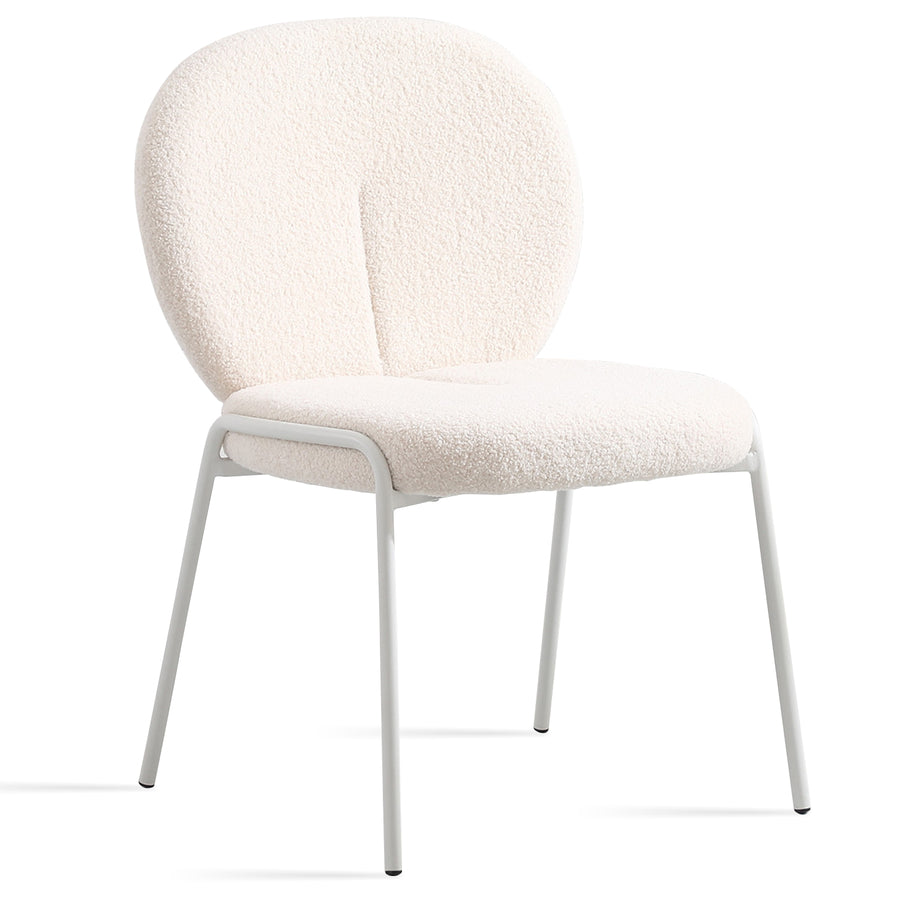 Cream boucle dining chair pavlova ii in white background.