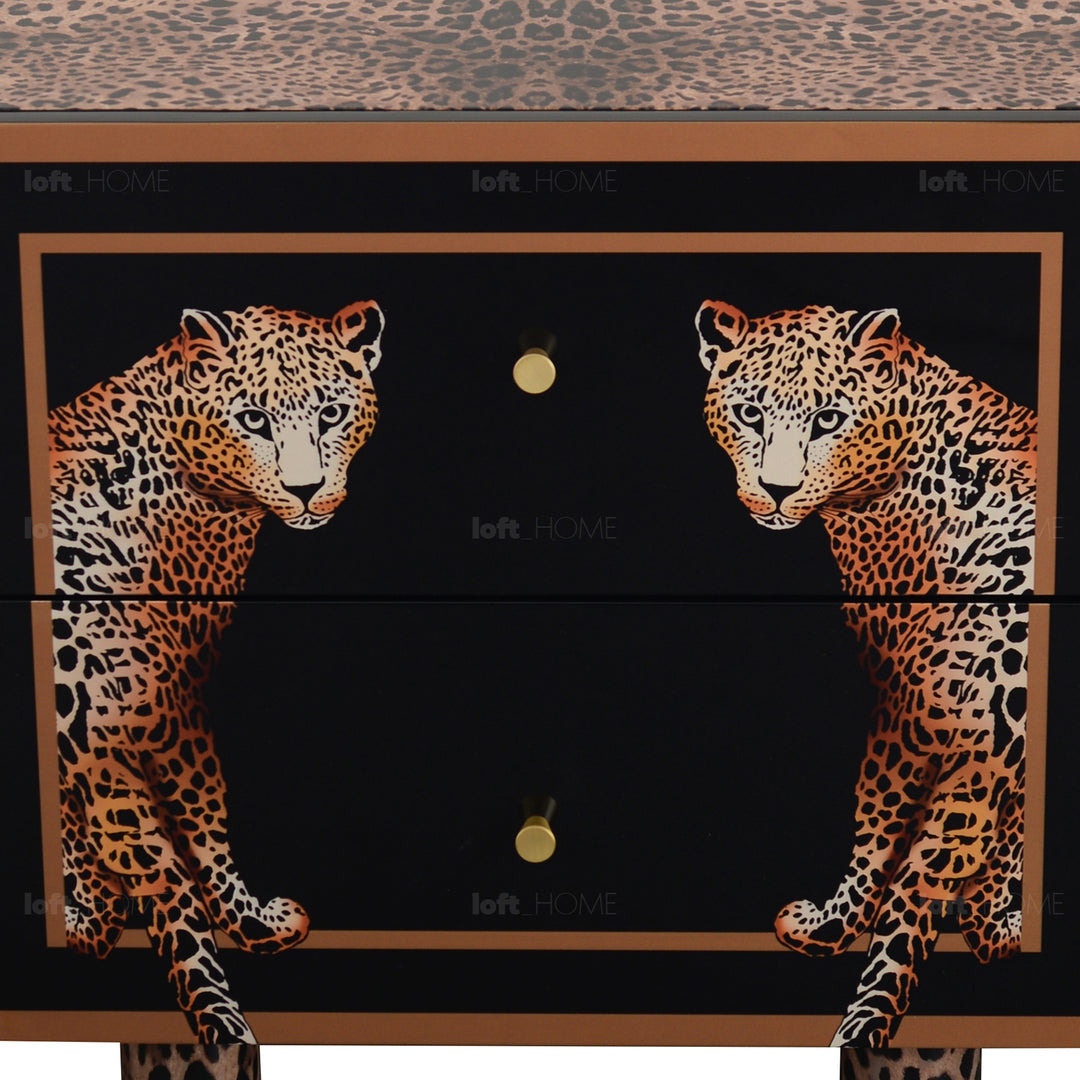 Eclectic wood drawer cabinet low leopard in still life.