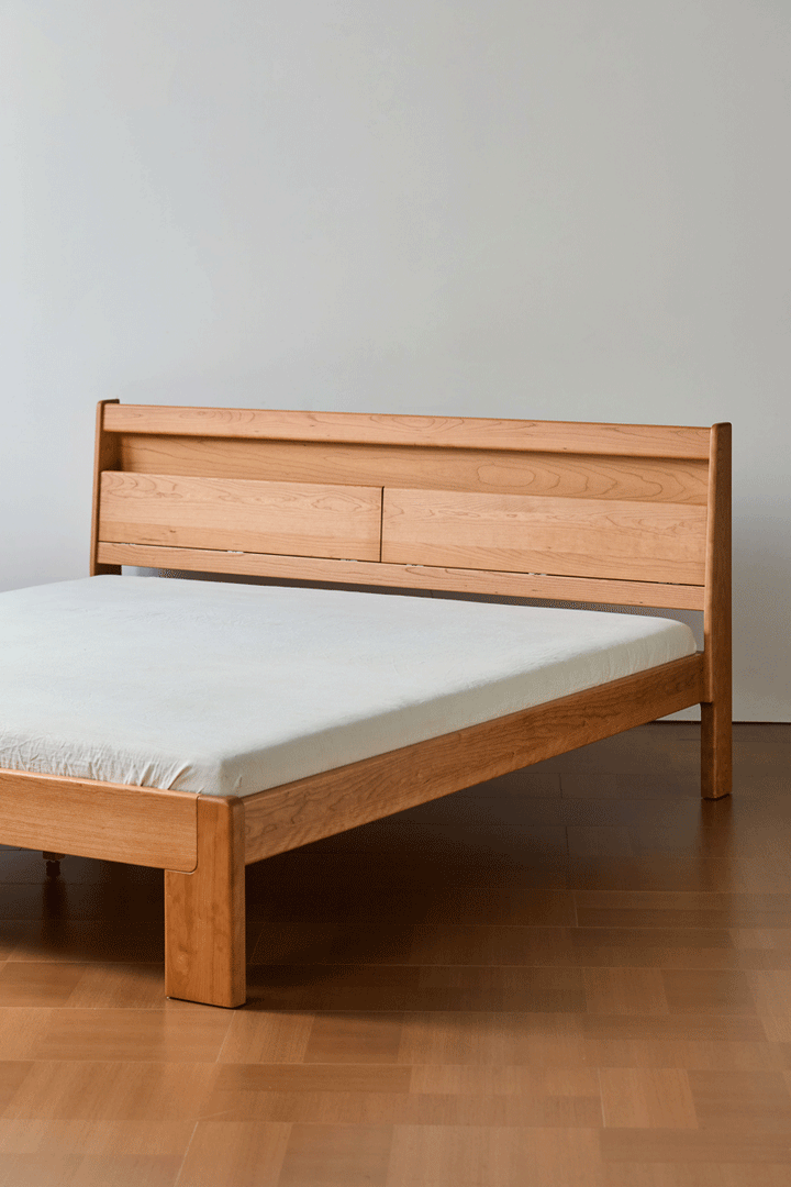 Scandinavian cherry wood bed accompany light color swatches.