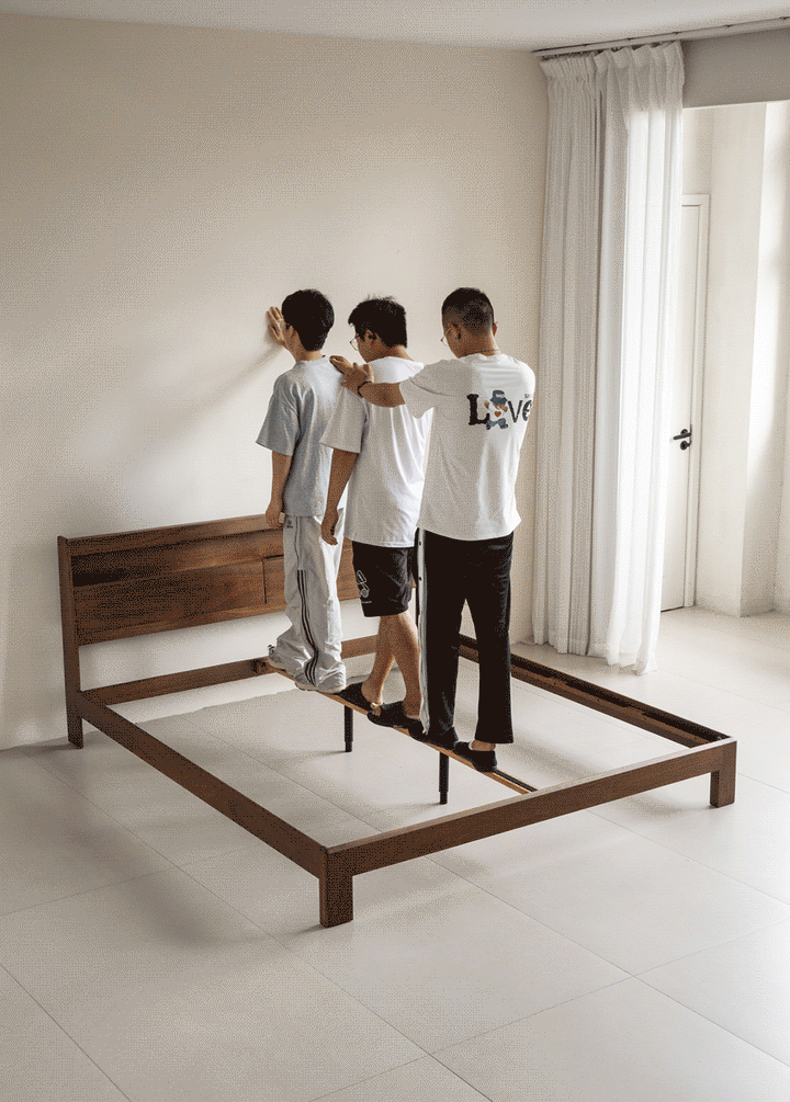 Vintage walnut wood bed accompany light color swatches.