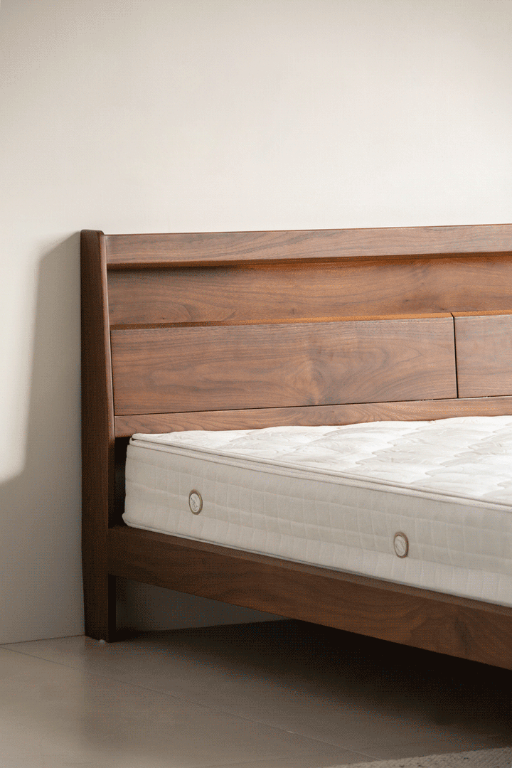 Vintage walnut wood bed accompany light layered structure.
