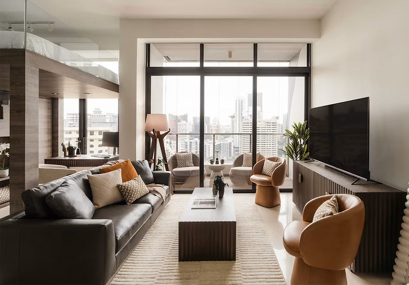A Dark-Toned Apartment That Feels Spacious