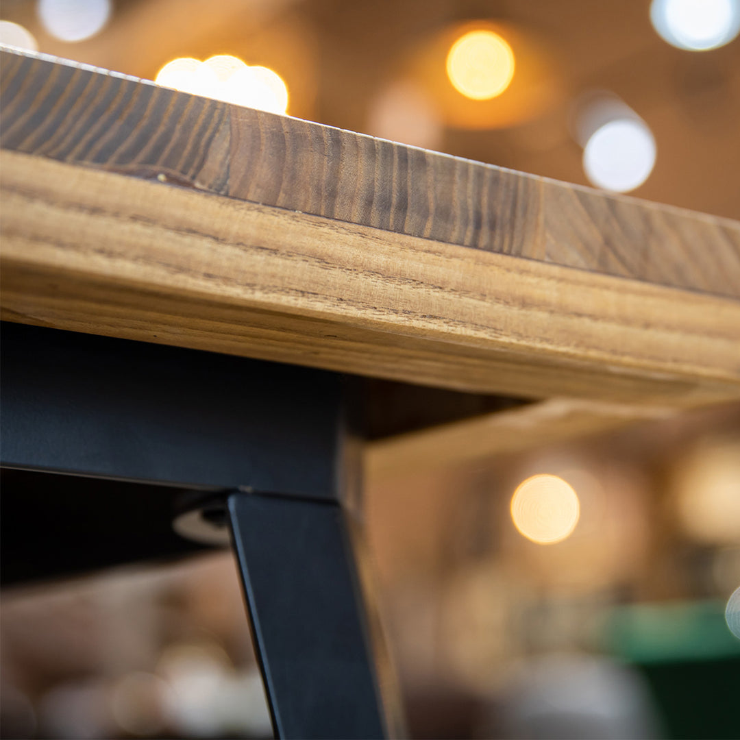 Industrial elm wood dining table ran in still life.