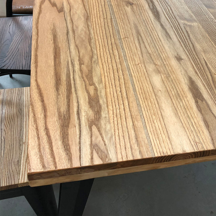 Industrial elm wood dining table ran in close up details.