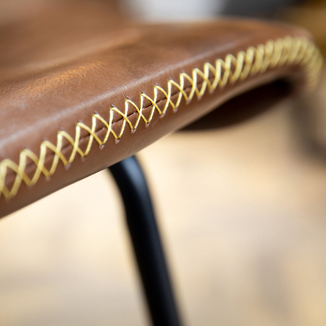 Industrial pu leather bar chair stitch in close up details.