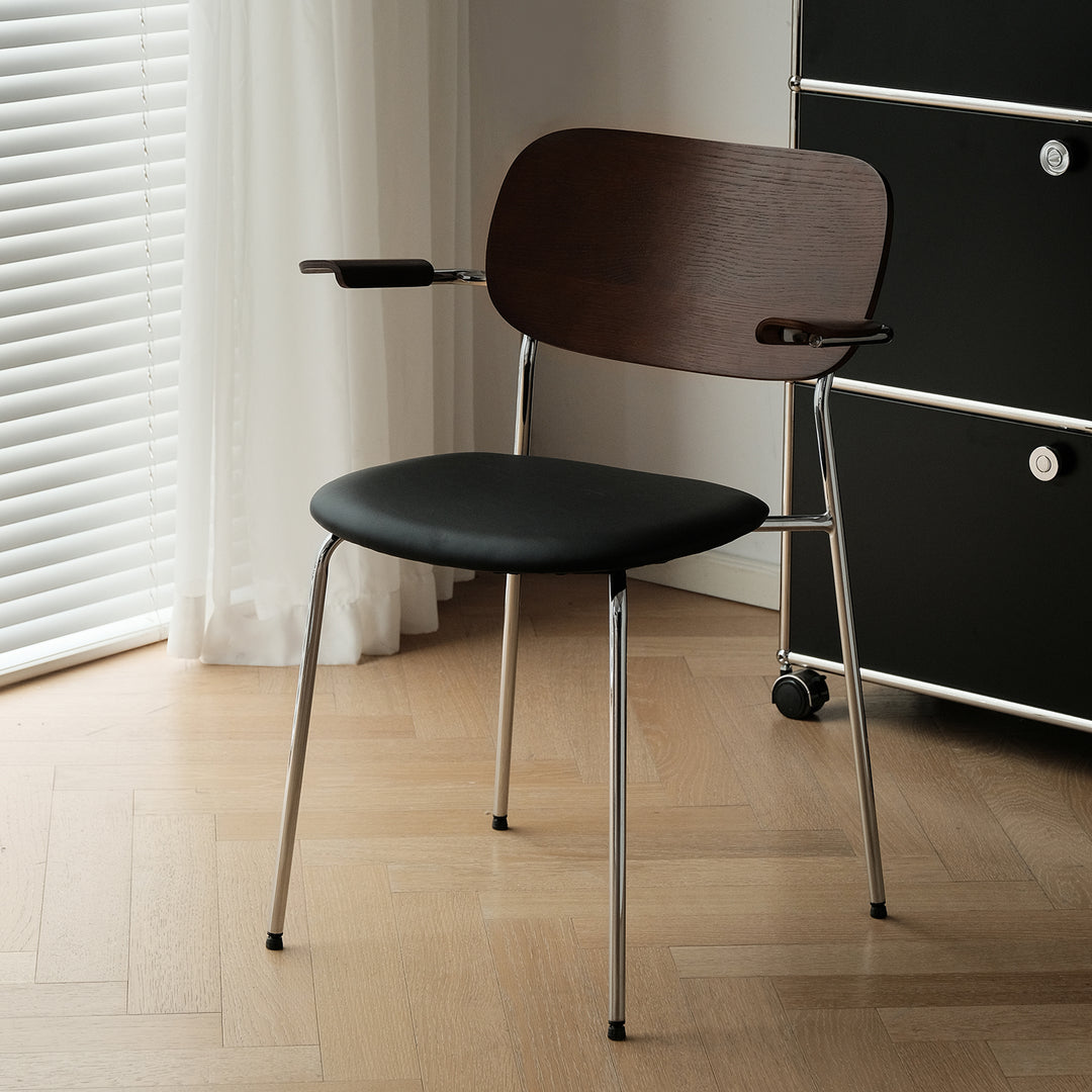 Industrial pu leather dining chair with armrest nika in white background.