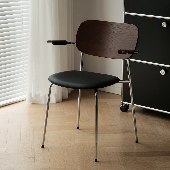 Industrial pu leather dining chair with armrest nika in white background.