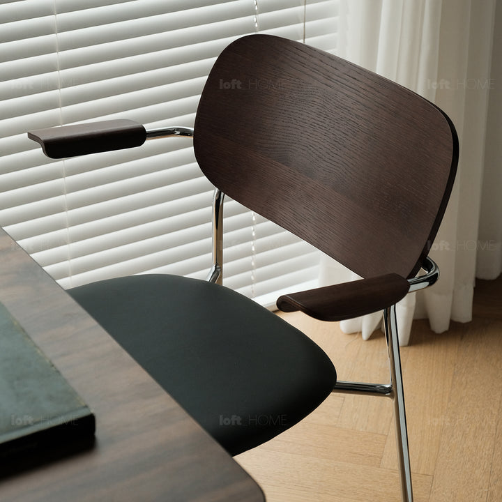 Industrial pu leather dining chair with armrest nika in panoramic view.