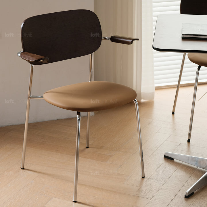 Industrial pu leather dining chair with armrest nika in still life.