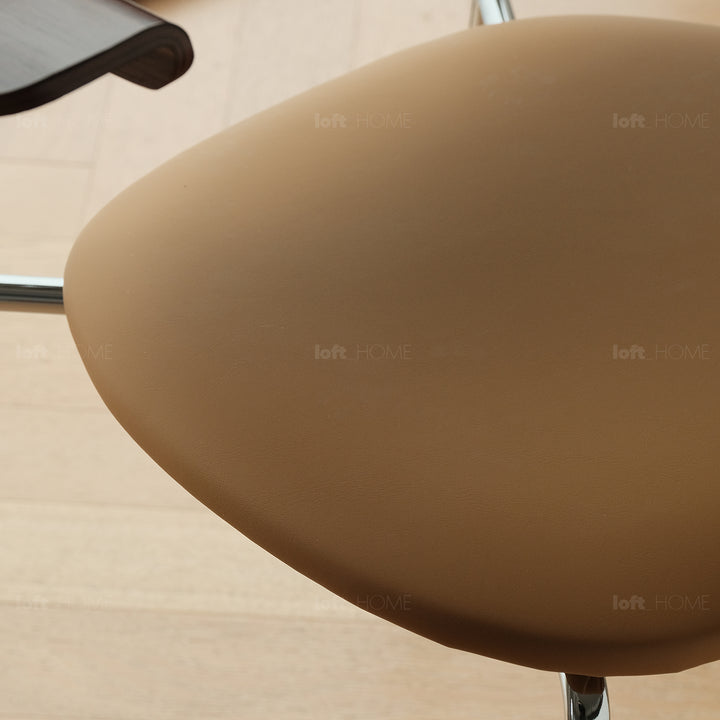 Industrial pu leather dining chair with armrest nika layered structure.