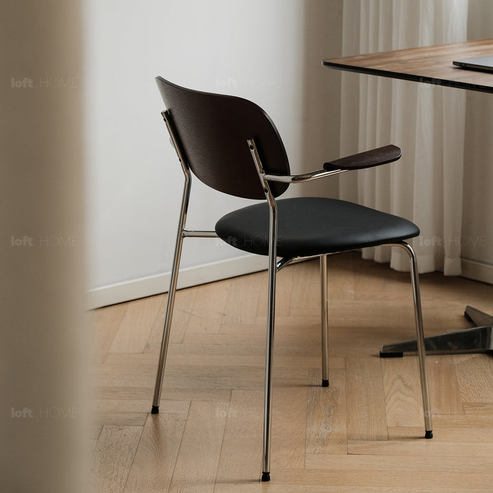 Industrial pu leather dining chair with armrest nika with context.